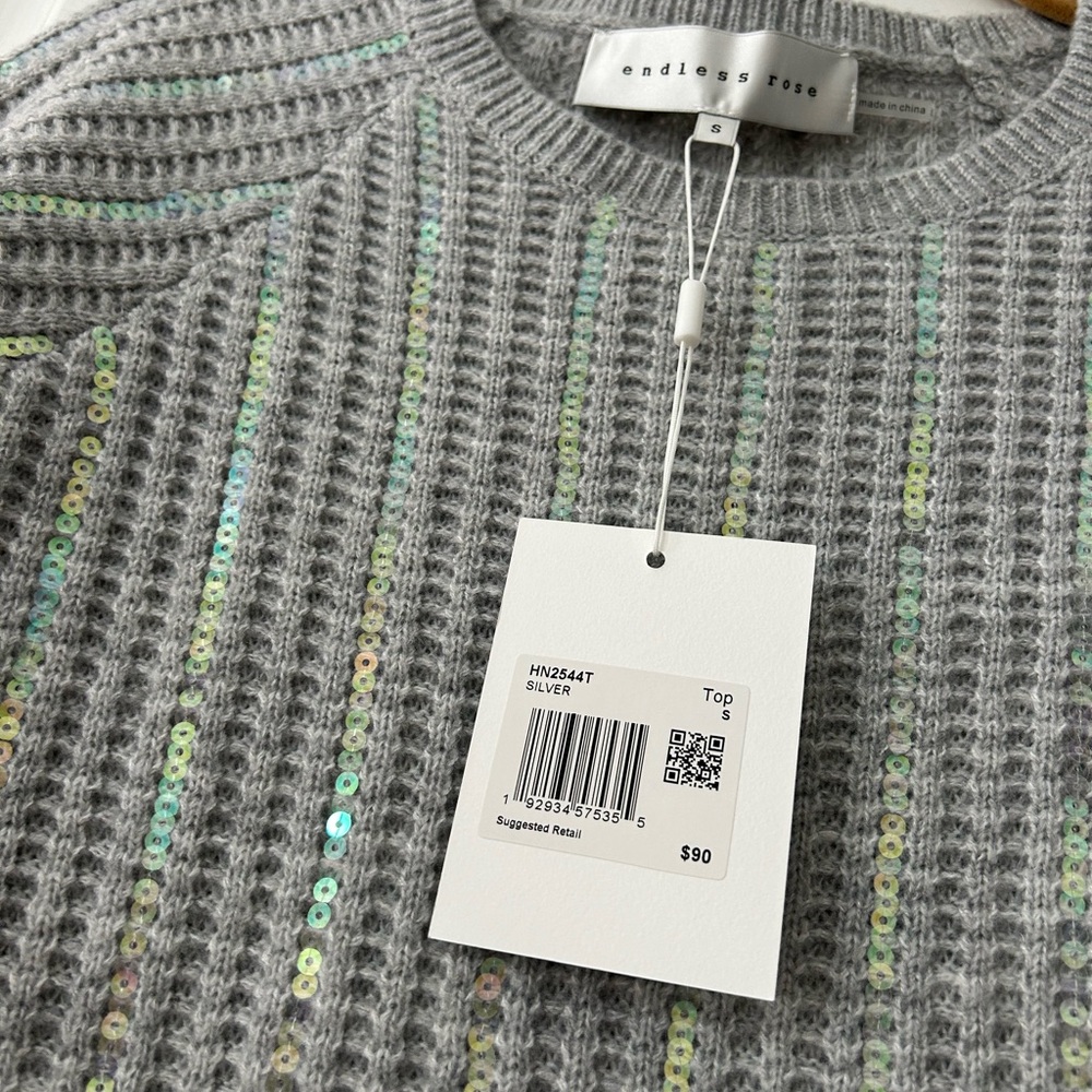 Sequin soft silver short sleeve sweater. New with tags.